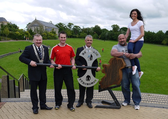 Letterkenny - Rising to New Heights. Erin Coyle of Media Box tests the strength of former World and UK Strongman Dave Warner at the launch of European Strongman Finals Under 90kg which take place in Letterkenny on the weekend of 14-15 September. Also pictured are Mayor of Letterkenny, Cllr. Dessie Larkin, President of Letterkenny Chamber John Watson, co-organiser Nigel Drein of Motiv8 Fitness. Photo by Steven Corcoran