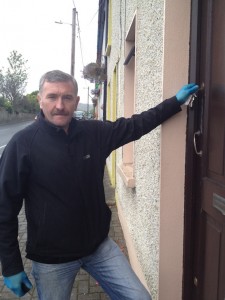 Flashback: Residents like this man in Ballymacool Terrace found their front doors glued last year.