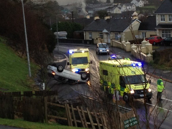The scene of the crash at Glencar just minutes after it flipped onto its roof.