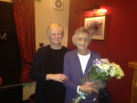Esther McGrenra presents Ann with some flowers