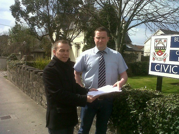 Cllr Ciaran McLaughlin gathers the signatures