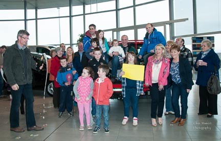 Donegal's Ice Road Trekkers return to Letterkenny Denis Ferry, Les O'Donnell and Paul Donerty are greeted by family and friends at Hegarty's Ford Garage on Sunday evening. Photo:- Clive Wasson