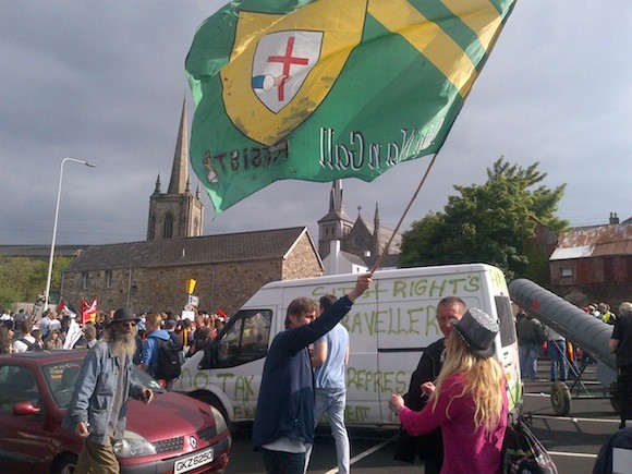 Anti-austerity protesters from wave a Donegal flag in Enniskillen