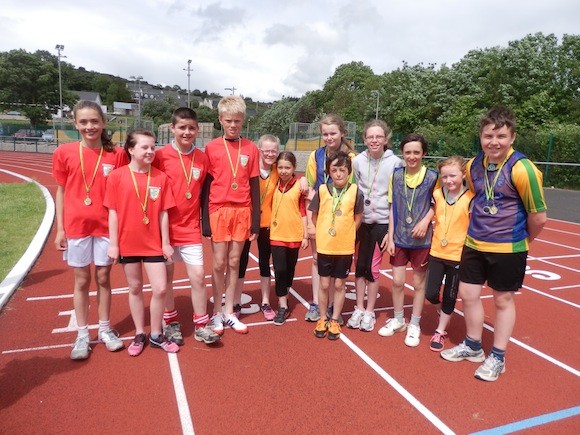 The winning relay teams at the small school's championships.