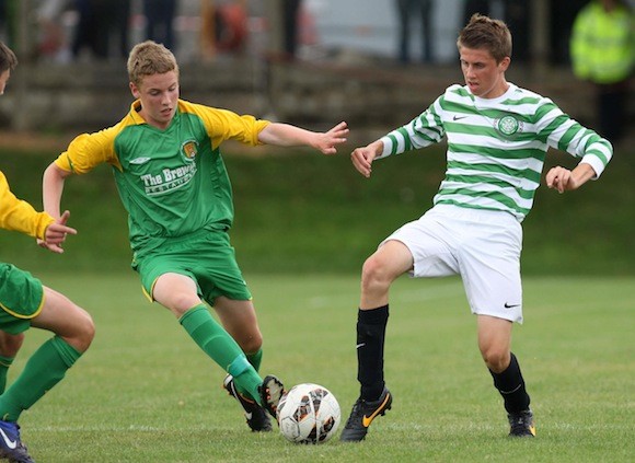 Donegal Schoolboy's Jack Keeney competes for the ball with a Celtic midfielder. Pic.: Gary Foy