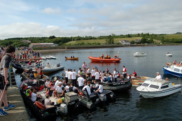 The flotilla lands at the pier