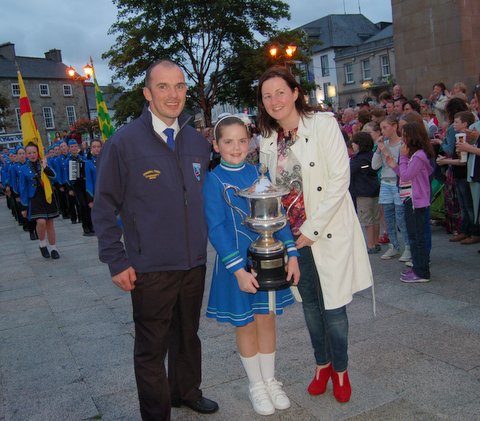 Catlyn Duffy with the All Ireland Cup and two of the founding members of the band; Pauric Kennedy and Linda O'Donnell