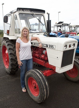 Patricia Hill of Stateside Restaurant, Letterkenny stops for a quick pic during the Drumoghill NS Tractor Run.