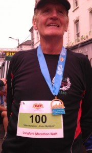 Peter celebrates with his 100th marathon medal!