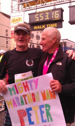 Peter celebrates with his friend Seamus Temple at the finish line today.