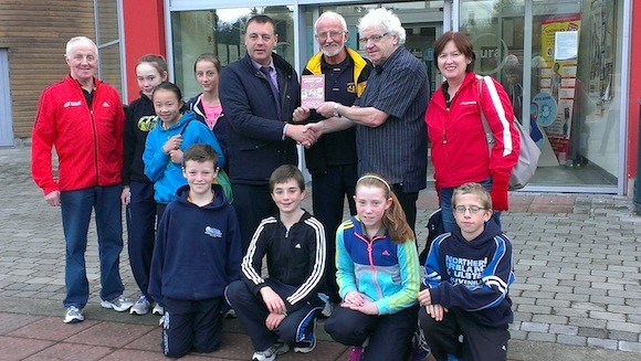 Caption - Johnny McCollum presenting Letterkenny Athletic Club Chairman Brendan McDaid with a copy of a DVD chronicling the history of the club. Also included are committee members Neily McDaid, Danny McDaid and Bernie Walsh along with juvenile members. The DVD will be launched at the club's annual presentation in the Station House Hotel, Letterkenny on Friday, September 27th  