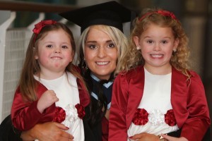 Graduant Leanne Mcclelland with her daughters Mia and Amy when she was conferred with her degree in Business Administration.