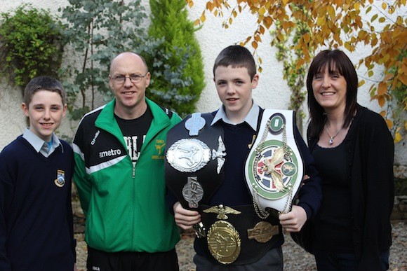 Damien celebrates his historic win with his family. From left, his brother William, father Cathal and mother Arlene