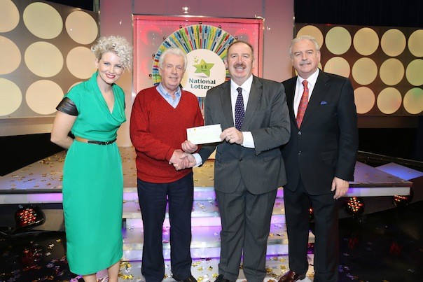 Francis Diver from Derrybeg, Co. Donegal won €37,000 on the National Lottery Winning Streak Game Show on RTE, on Saturday 11 January 2014. Pictured at the presentation of winning cheques were, from left to right: Sinead Kennedy, game show co-host; Francis Diver, the winning player; Peter Plunkett, Head of IT, The National Lottery and Marty Whelan, game show co-host. The winning ticket was bought from Spar, Derrybeg, Letterkenny, Co. Donegal. Pic: Mac Innes Photography