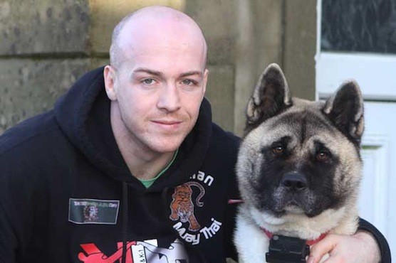 World Kickboxing champion Tommy McCafferty with  Saorise his prize Akita which was returned to his home after being taken on Monday  (NewspixIrl)