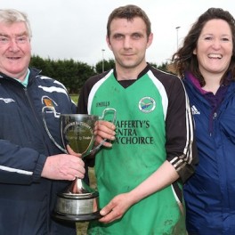 Donegal Junior League Administrator Terry Leyden pictured presenting the Downtown Cup to Tommy Rodgers captain of Glenea United Reserves. Included is League Secretary Christina O