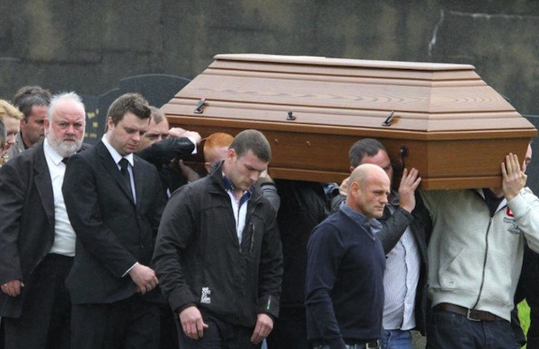 The coffin of the late Enda McLaughlin is brought to its final resting place.