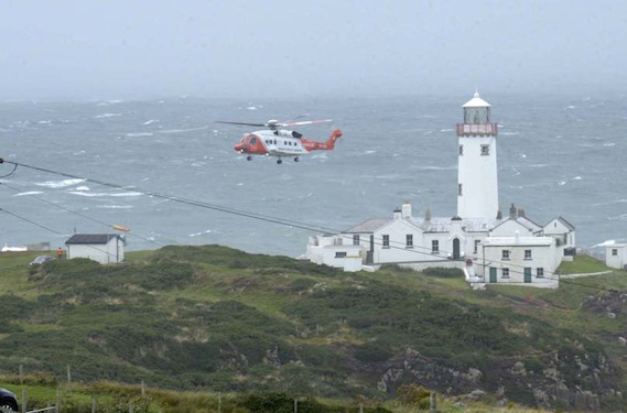 The scene at Fanad Lighthouse in north Donegal this afternoon as the Irish Coast Guard Rescue helicopter taking the victim ashore following a search and rescue operation. Photo by John McAteer.