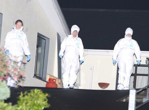 Officials from the State Pathologist's office at the couple's home last night. Pic copyright of North West News Pix.