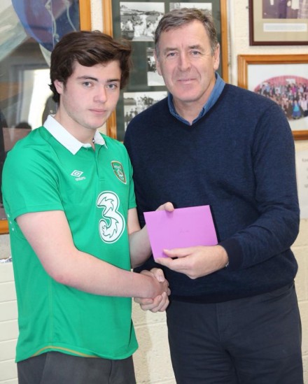 Packie Bonner making a presentation to James Boyle who's been selected to represent Ireland at the Football for all World cup in Mexico. 