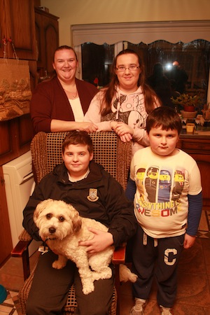 Harry the family pet gets in for the photo with the Nesbitt family Dillion Ethan Kelly and Marie pictured at their home , Wiinner of the 1st week prize in the Cristeph Studio and Donegal Daily Portrait Competition.  Photo Brian McDaid