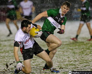 Mark McHugh battles for possession in the snow during their superb extra-time win over Queen's University Belfast last night. 