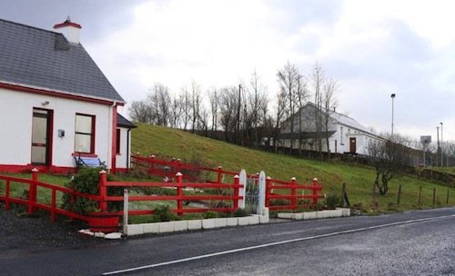 Mr Coyle's home on the left and the Barnesmore Community Centre on the right. Pic copyright of Northwest Newspix.