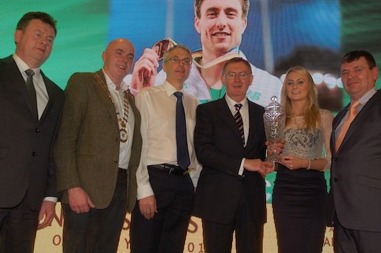 Michelle English accepts the 2014 Overall Donegal Sports Star Award on behalf of Mark English from special guest Sean O'Rourke. Also included are Council Chief Executive Seamus Neely,Cathaoirleach Cllr John Campbell and Sports Star Chairperson Neil Martin