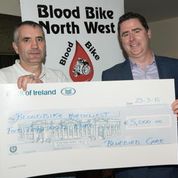 Marty presents Bernard with a cheque for an incredible €5,000 for Blood Bikes North-West.