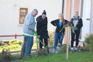 Mr Bernard Houston and his family at the scene where the grenade was found. Pic by Brian McDaid.
