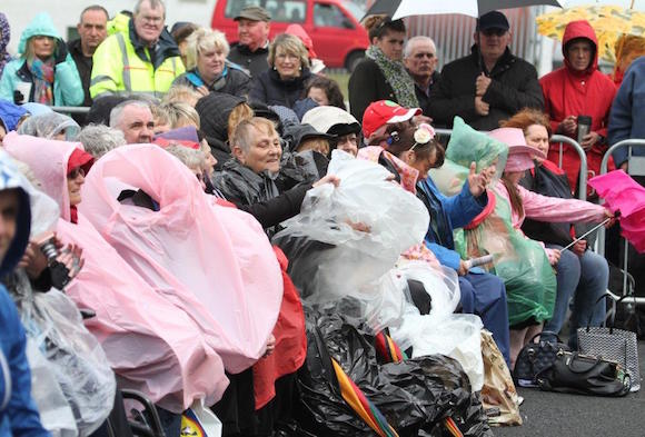 Fans had to get well wrapped-up in the horrific weather conditions. Pic by Northwest Newspix.