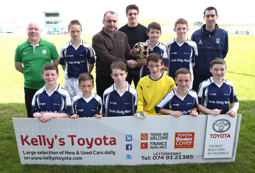 Glenties N.S. Boys team who won their section in the Fran Fields Cup 2015 which was held by Finn Harps Schools on Tuesday at Finn Park. Presenting the trophy is Brendan Kelly of Kelly's Toyota. Included is Louis Fields. Pic.: Gary Foy, newsandsportfiles@hotmail.com