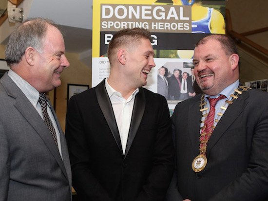 Pat Ryan, chairman of the Irish Amateur Boxing Association and chairman of Donegal County Council, Ciaran Brogan enjoy a joke with Jason Quigley.