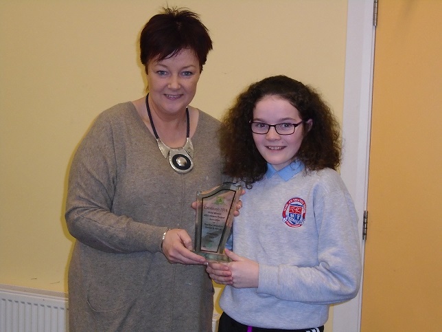 Orla Gallagher receiving plaque from Jackie Dillon.