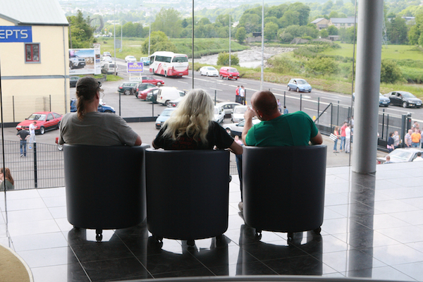 There is your bus. Guests at the Toyata Fest enjoying the view from the Showroom of Kelly's at the Toyota Fest this week. Photo Brian McDaid