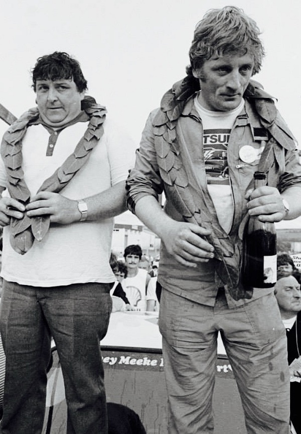 Meeks's first Donegal local heroes Vincent Bonnar and Seamus Mc Gettigan celebrate the win on the on the bonnet of their Ford Escort in '83. On the windscreen behind them Sydney Meeke, ,Kris Meeke fathers name is proudly on display, It also was his first Donegal win as a rally car specialist.