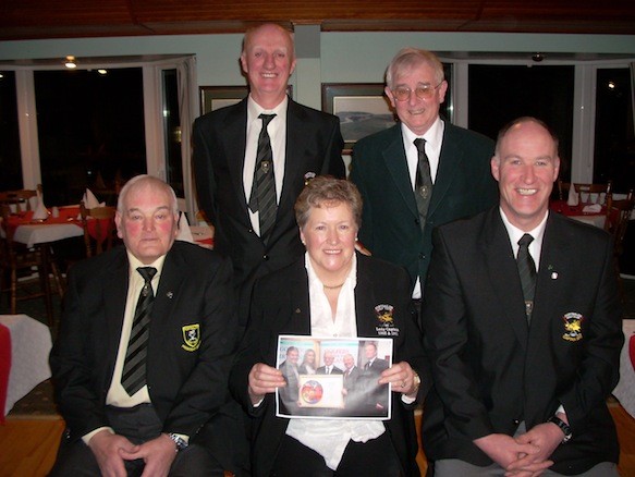 Front Row Past President Wm Mc Cleary, President Kathleen Mc Cormick, Past Captain D P Logue. Back Row Captain Joe Harkin, & Paid MC Menemin who accepted the prize on behalf of Portsalon Golf Club.    