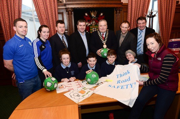 Donegal County Council and Finn Harps Schools Road Safety Arts Competition launch. Teacher Laura McGowan with her students Rachel Mitchelle, Kevin McColgan, Corey McGettigan and Roisin Brennan as they discuss poster ideas. Back from left are Kevin McHugh, Chantelle Grant, Seamus Neeley, County Manager, Joey O'Leary, Finn Harps Chairman, Frank McBrearty Donegal Mayor, Eamonn Browne, Donegal Road Safety Officer and John Campbell, Finn Harps. Pic: Clive Wasson