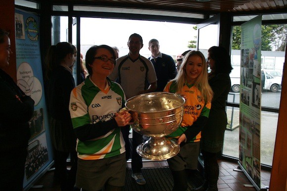 Aoife McMenamin and Tara O'Brien delighted to be the first to get their hands on the cup when Sam visited Crana College