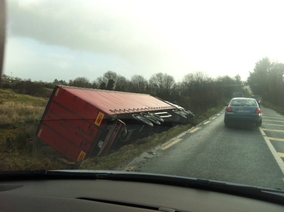 Drivers take it easy passing the overturned lorry