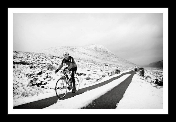 Snow joke! A hardy member of the Four Masters Cycling Club takes part in the charity cycle
