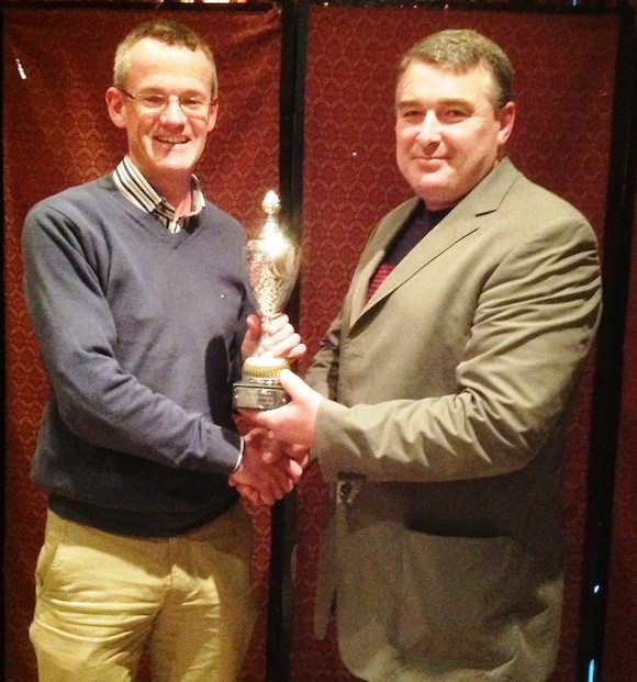 Club person Richard McCarthy[left] receives award from club chairman Paul OGara