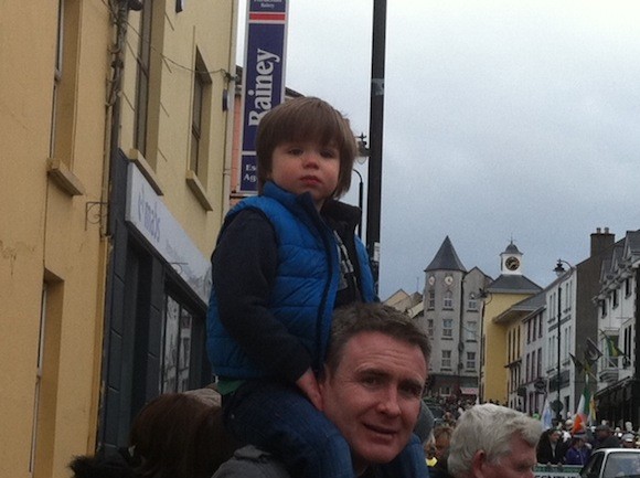 John Gildea and son Fionn enjoy the parade this afternoon