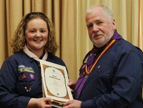 Dara Coll gets her award form Chief Scout Michael John Shinnick 