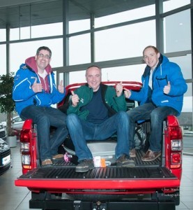 Donegal's Ice Road Trekkers return to Letterkenny Denis Ferry, Les O'Donnell and Paul Donerty are greeted by family and friends at Hegarty's Ford Garage on Sunday evening. Photo:- Clive Wasson