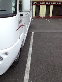 Mark parked carefully between the parking lines