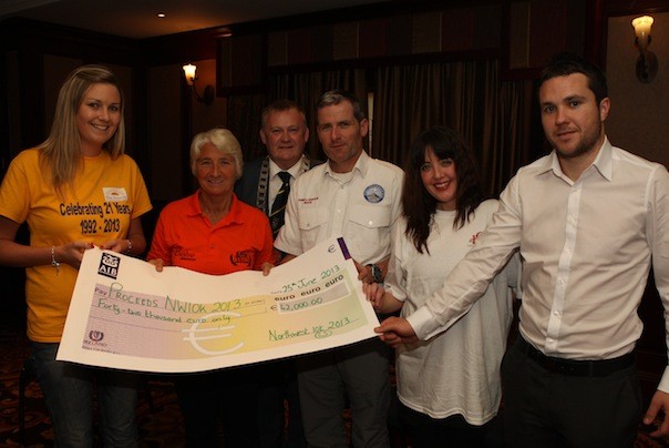 Donna Henderson, Leo Murray And Samantha Robinson representing groups that benefited from the proceeds of 42,000 euros which was raised by the 2013  North West 10k they are pictured with Grace Boyle, Town Mayor Cllr. Dessie Larkin  and Mark Forker representing Donegal Daily