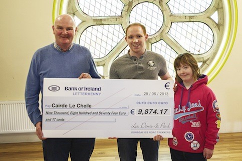 Mick Quinliven of Cairde Le Cheile accepted the cheque from Paul Doherty and Paul's sister Claire. 