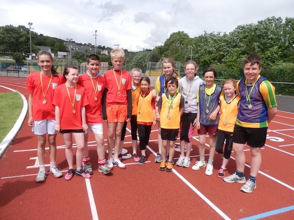 The winning relay teams at the small school's championships.