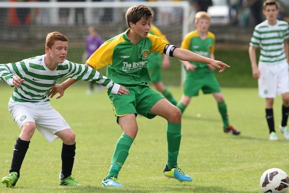 Donegal Schoolboys Under-14 team captain Shane Blaney shields the ball from a Glasgow Celtic player during the match between the sides at the 2013 Foyle Cup in Derry. Pic.: Gary Foy